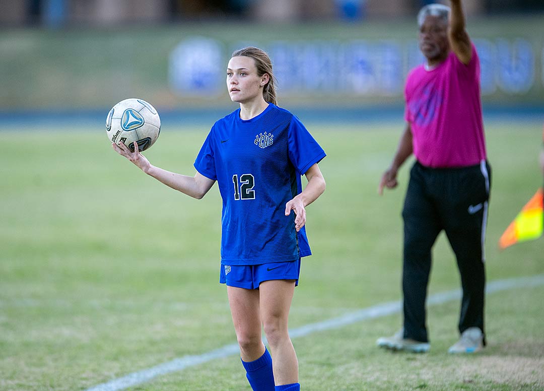 Polk County's Molly Justice looks for a teammate for a throw-in during a recent game