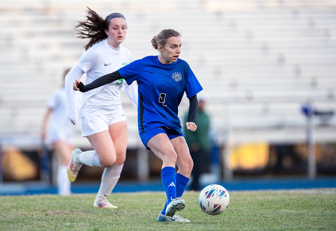 Polk County's Leah Savaia prepares to clear a ball upfield during the second half of Thursday's match